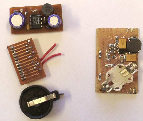 The old boards and battery holder, next to the new integrated design